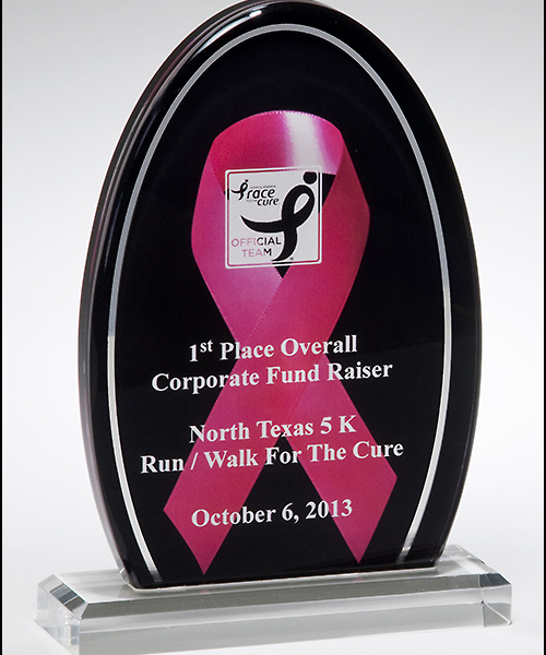 Breast cancer awareness acrylic. Pink ribbon against a black background with a mirror silver border.